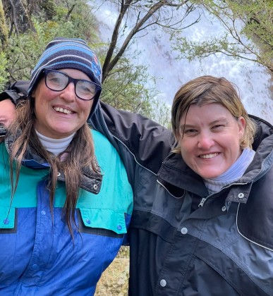 Two women smiling at camera
